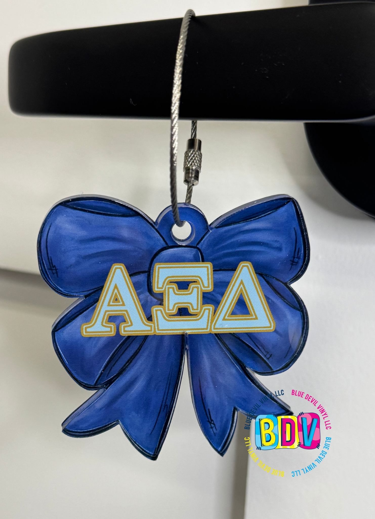 Blue Bow with Light Blue Greek Letter outlined in Gold 