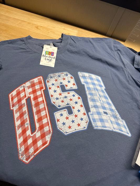 Blue t-shirt with 'USA' design featuring stars and patterns