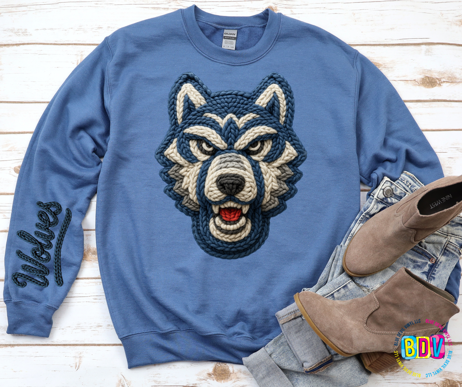 Indigo Blue sweatshirt with a wolf design and 'Wolves' text on sleeve.