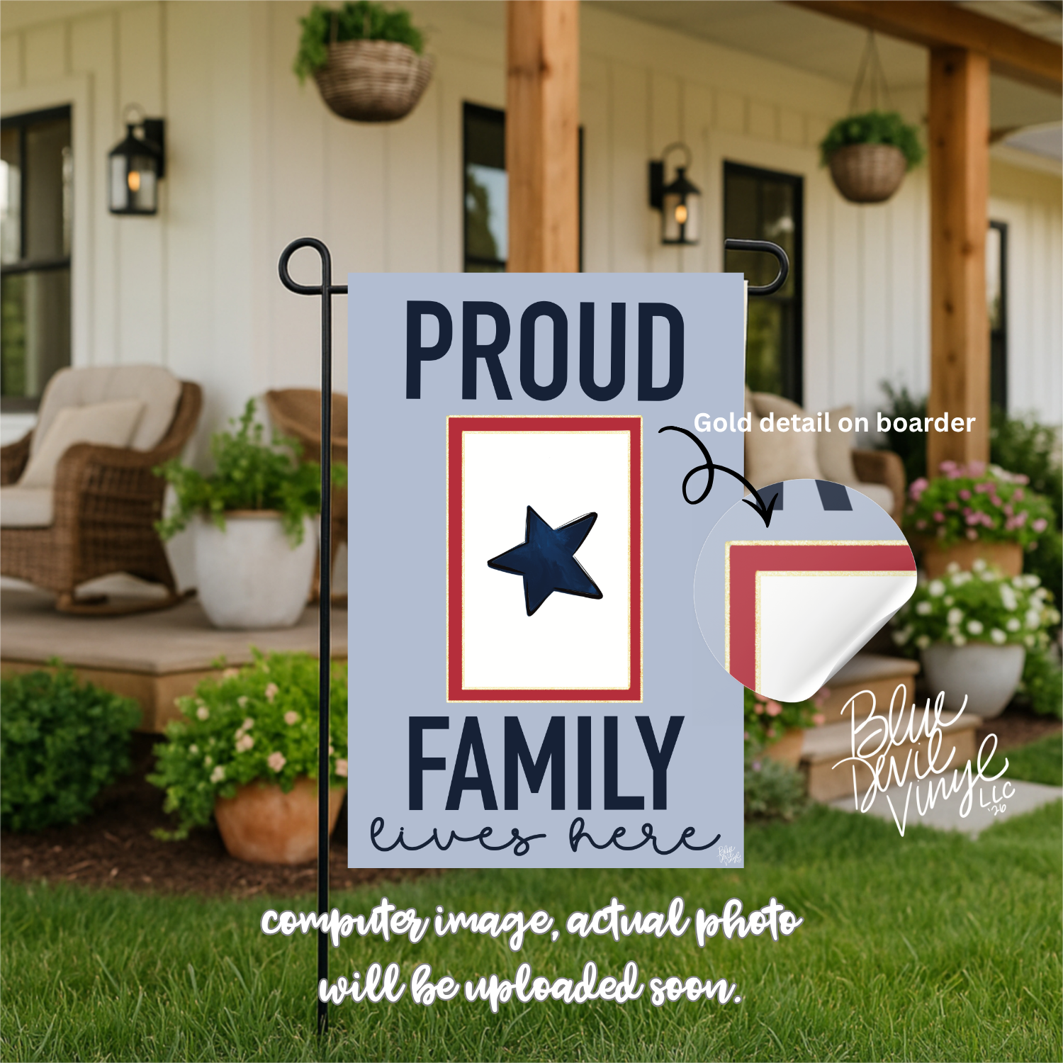 Decorative garden flag with 'Proud Family Lives Here' text and a star design, set against a blurred outdoor background.