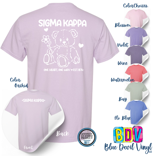 Purple t-shirt with teddy bear design and 'Sigma Kappa' text, color options displayed on the side.
